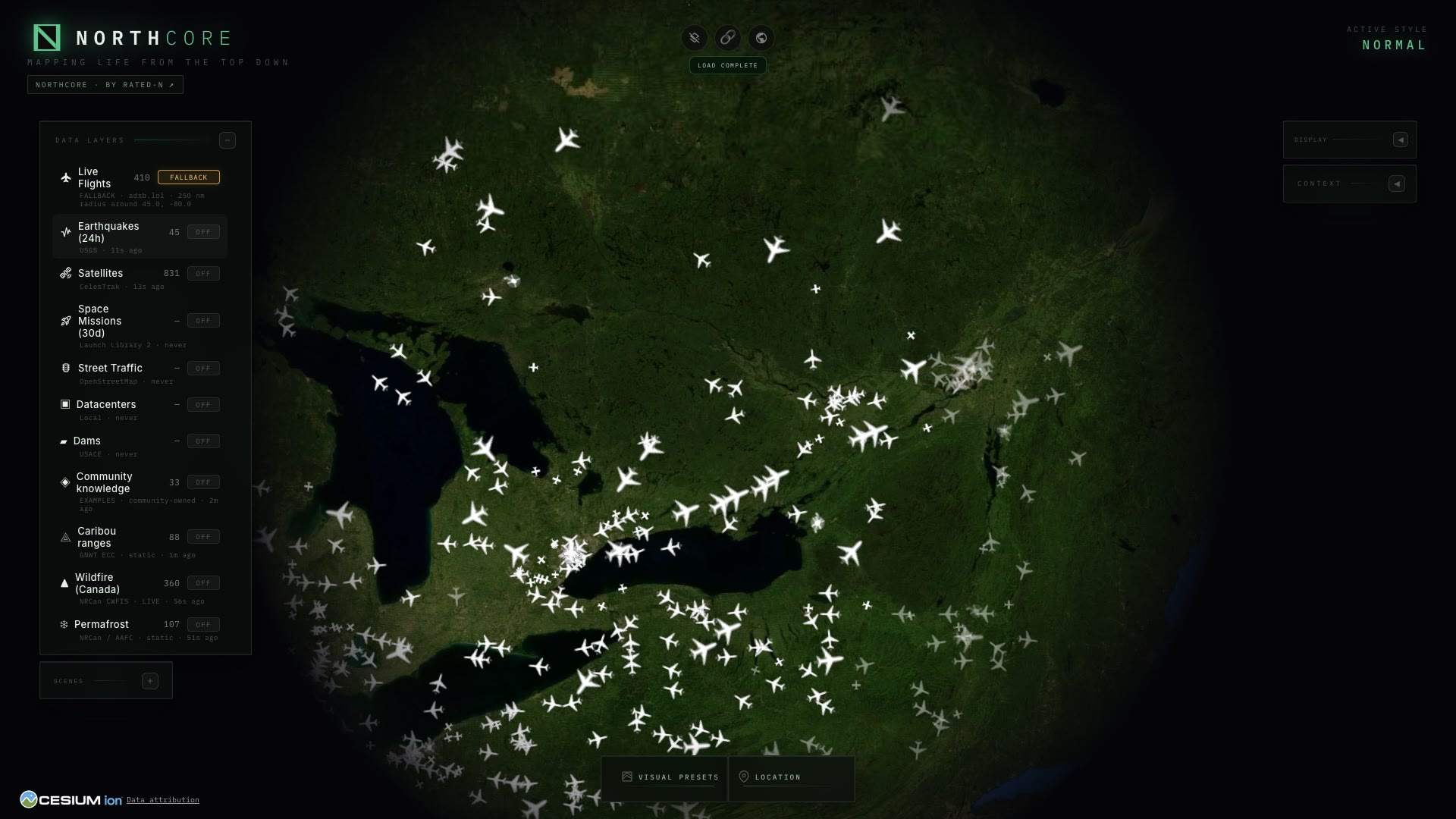 NorthCore live map of Canada with flights in the air and data layers for earthquakes, wildfire and caribou ranges